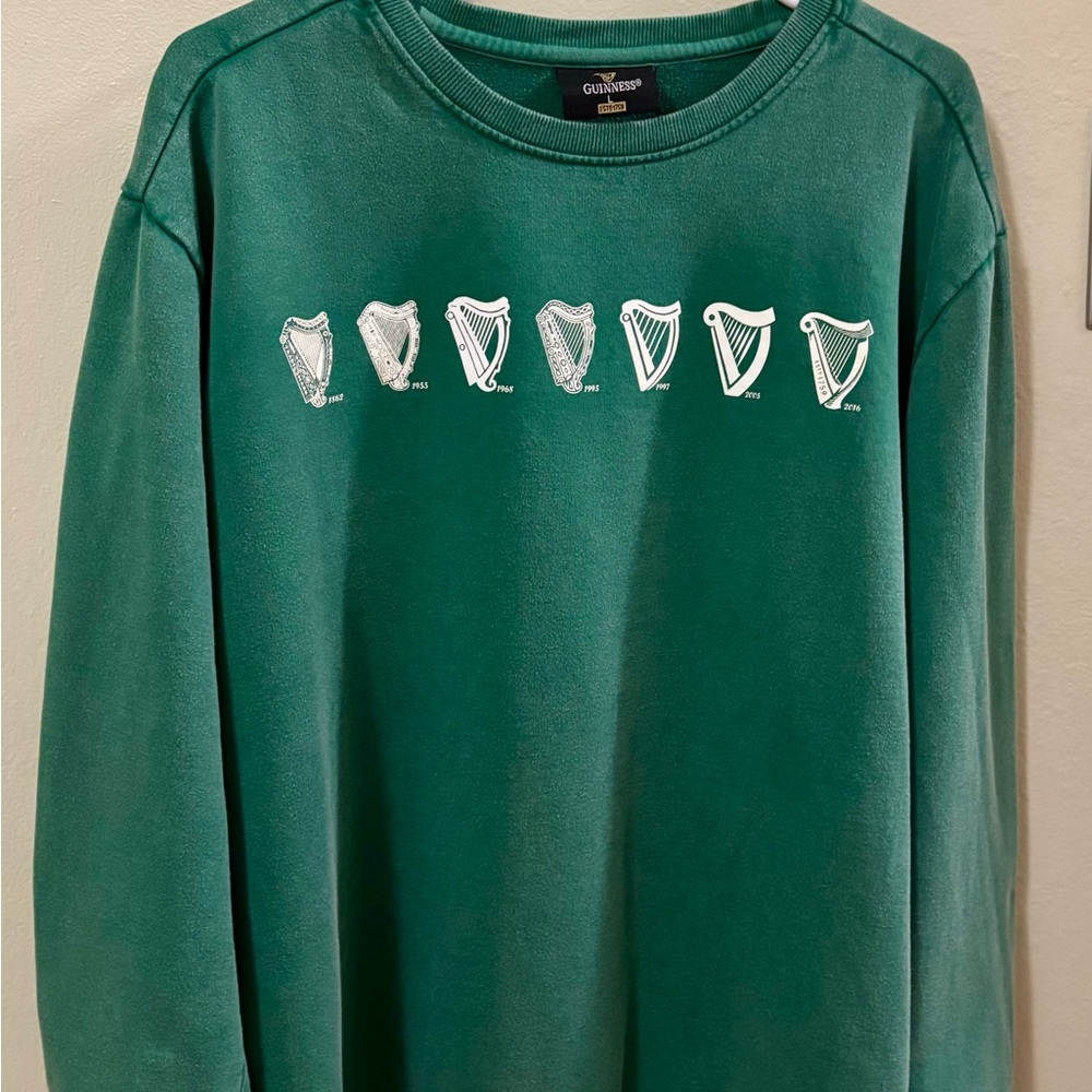 Celebrate St. Patrick’s Day! Guinness Sweatshirt with “Evolution of the Harp”.